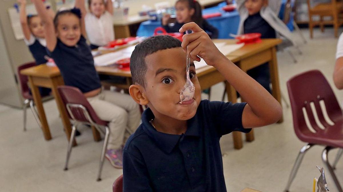 Michael Garcia, 6, and his classmates in Taine Perez's kindergarten class at Flagami Elementary school celebrate the last day of school on Thursday, June 9, 2016 with an ice cream party.