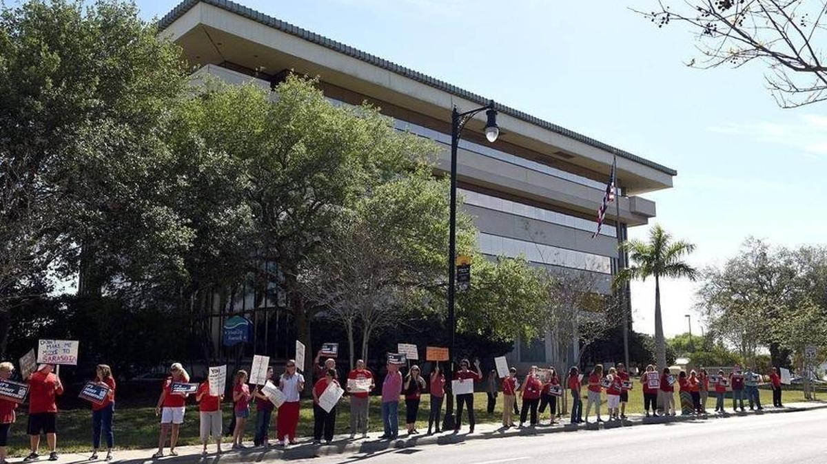 Teachers rally outside the Manatee County School District’s administration building on Manatee Avenue West before the school board’s impasse hearing on March 27.