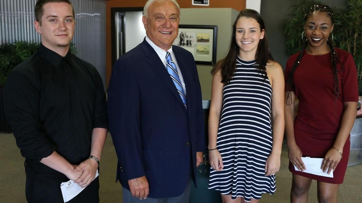 From left: Evan Edwards, Dolphin Aviation owner Ron Ciaravella, Niam Tanner and Amaia Cliatt on Friday morning after a scholarship ceremony.