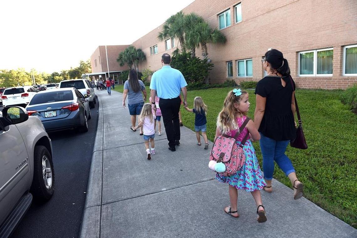 Families arrive on the first day of school at Jessie P. Miller in Bradenton Thursday.