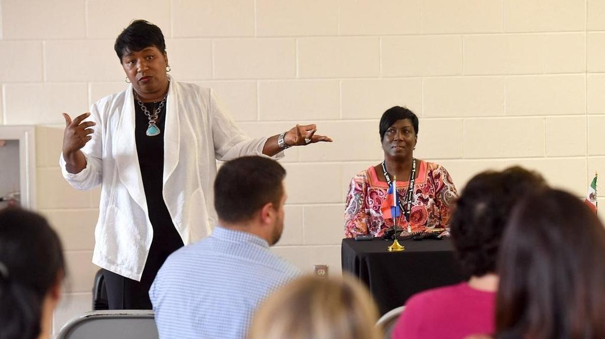 Diana Greene speaks to the crowd at a recent meeting she hosted at Johnson Middle School. Wakeland Elementary and Johnson Middle School parents attended the meeting to discuss the planned school merger for the 2017-18 school year.