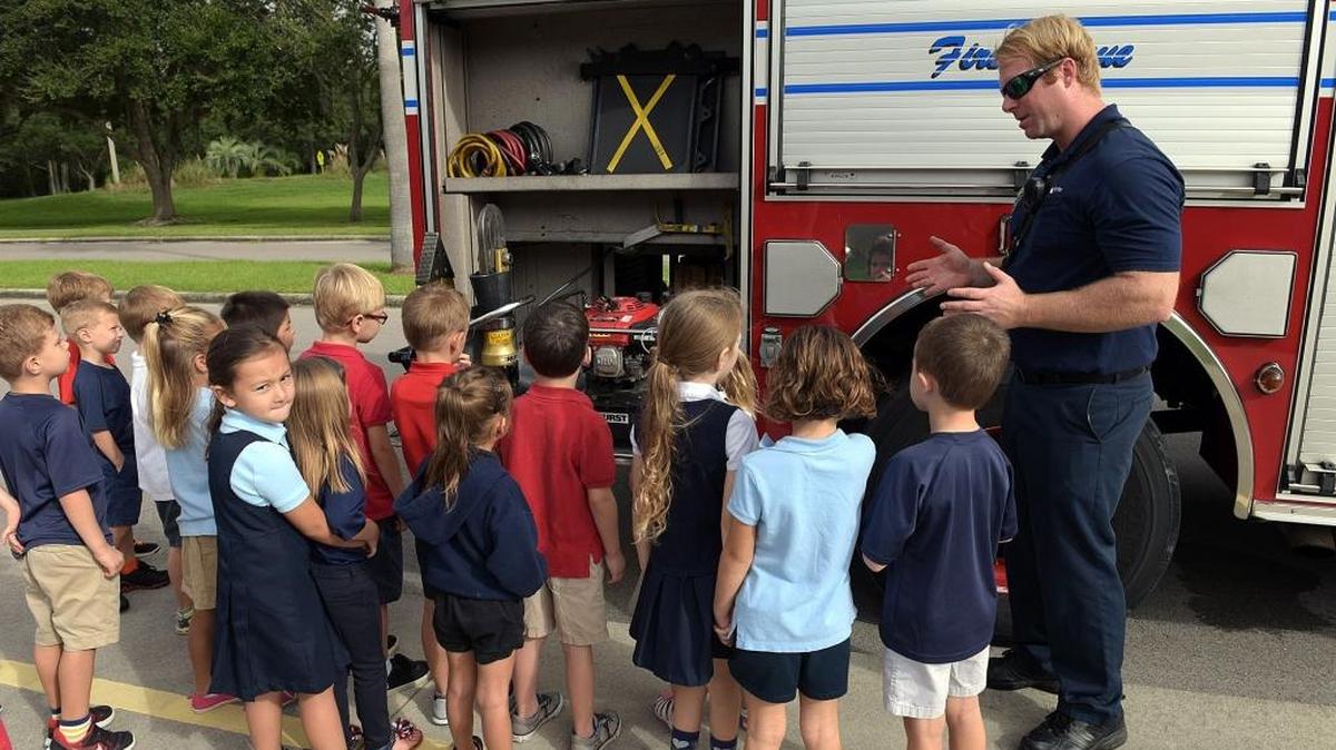 Firefighter Steve Baker with the East Manatee Fire Rescue visited Braden River Elementary School on Thursday, showing the students features on a fire truck and reminding students about safety features like "stop, drop and roll."