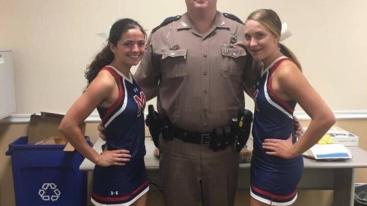 Manatee High School cheerleaders pose for a photo after giving thanks and gratitude to local police departments.
