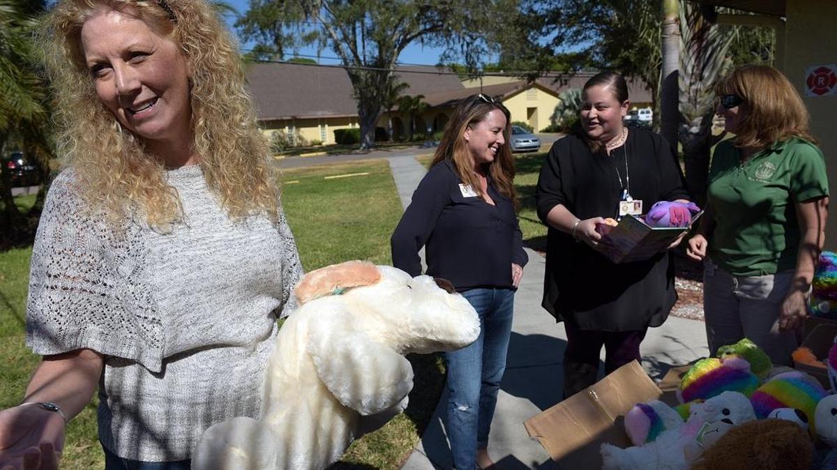 Church of the Cross' Lorri Vogel shows the boxes of new stuffed animals which were donated to local school children. During school psychology week social workers collected food items to donate to Elks Feeding Empty Little Tummies. Kami Lake, the social worker at Bayshore Elementary School delivered the food to Lorri Vogel at Church of thte Cross in Bradenton. In return, Elks FELT donated stuffed animals for Manatee County school children as part of the Giving Tree project.