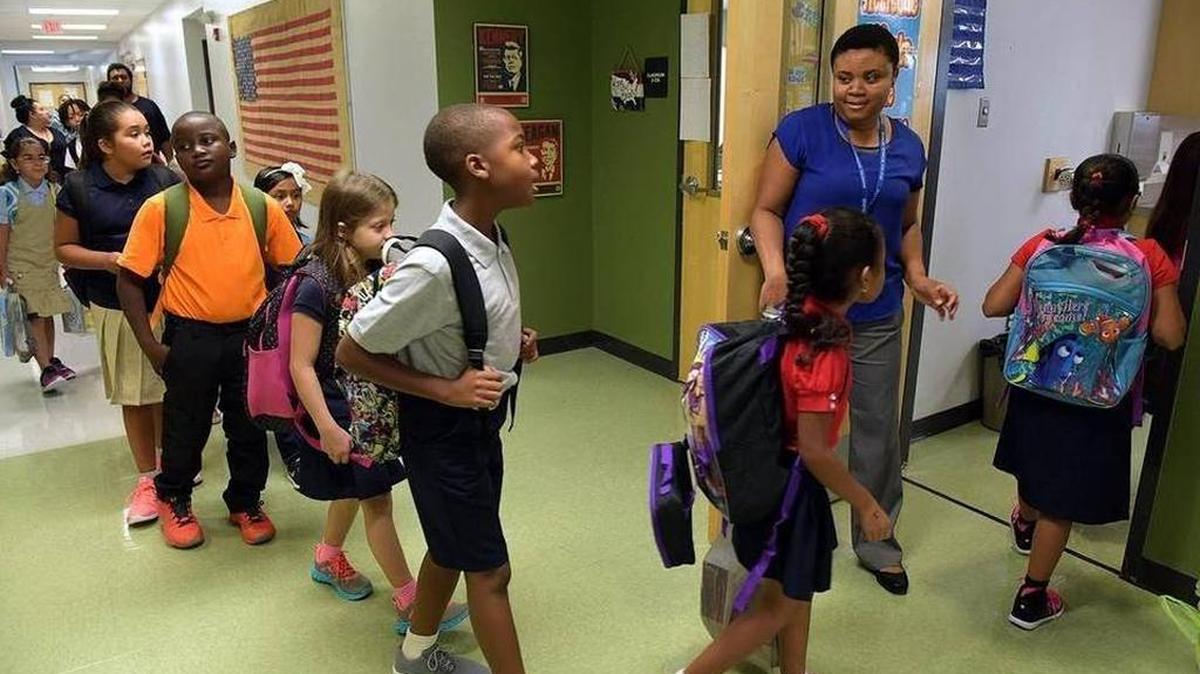Third-graders head to their classroom at Rogers Garden-Bullock Elementary School on Aug. 10, the first day of school in Bradenton.