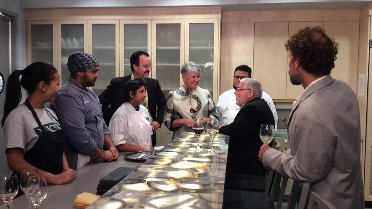 In this file photo, Pat Moreo, seated at right, talks with students and visitors in University of South Florida Sarasota-Manatee’s culinary innovation lab on Main Street in Lakewood Ranch.