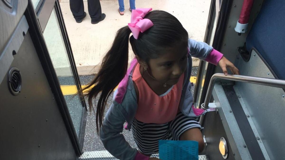 Yoselin Rodriguez boards the bus to return home after a day of learning about animals and reading at Bashaw Elementary School’s Camp RISE summer program for the district’s Title I students.
