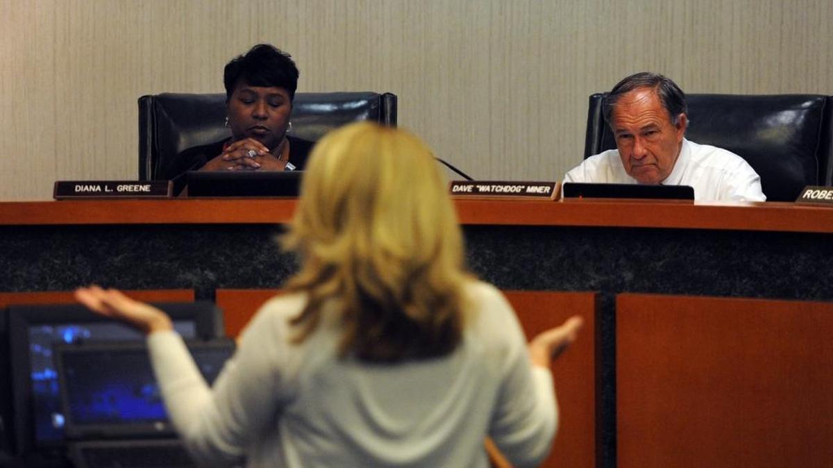 In this file photo, Superintendent Diana Greene and Manatee County School Board member Dave Miner listen to Amy Lee as she addresses the student progression plan during public comments at a workshop at the School Support Center in Bradenton.