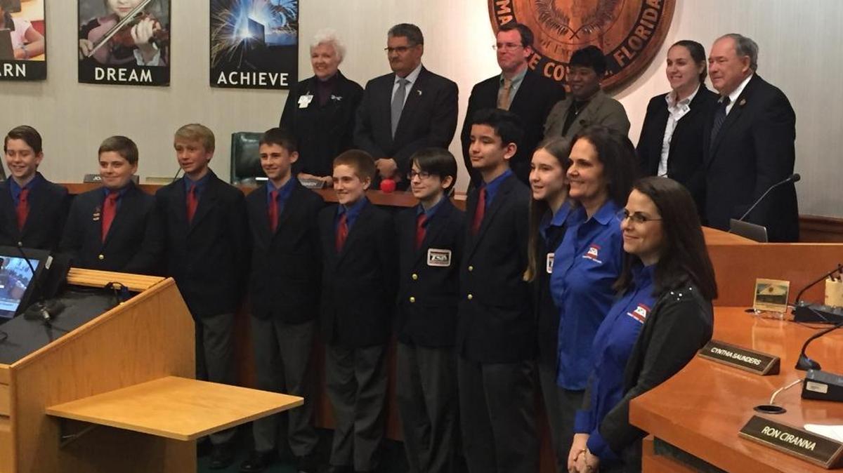 Members of the Haile Middle School Technology Student Association pose with the Manatee County School Board at Tuesday night’s meeting.