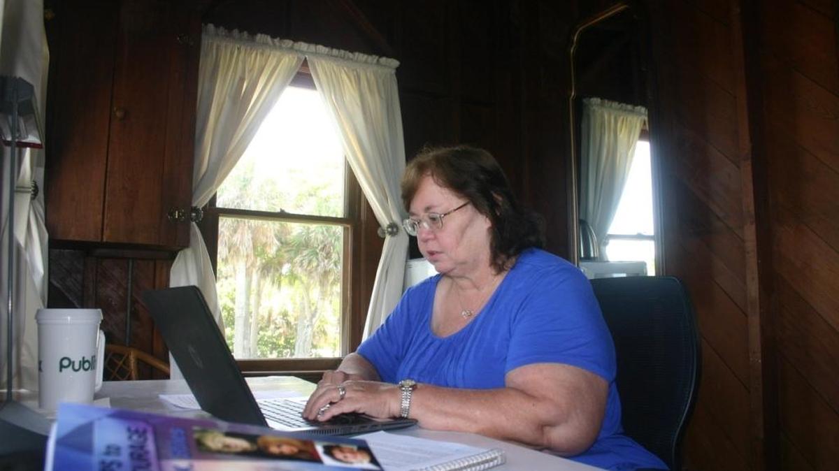 Sandra Stiles, an English teacher at Johnson Middle School, works on a young-adult novel during her time at the Hermitage Artist Retreat in Englewood. Stiles was one of five teachers in the state selected to complete a three-week artist residency, where she worked on her writing.