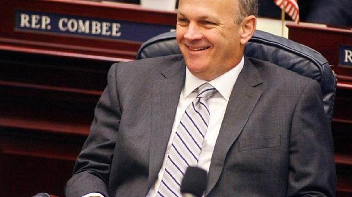 In this file photo, Rep. Richard Corcoran, then the House redistricting chairman, smiles on the floor of the House of Representatives, Aug. 7, 2014. Corcoran has been a strong advocate for the teacher bonus program.