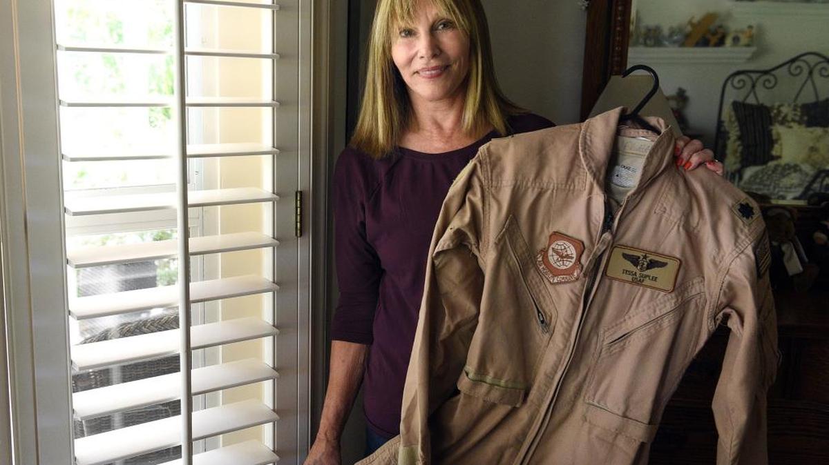 State College of Florida Alumna Tessa Suplee will receive the Life Achievement Award at the 2017 LeRoy Collins Distinguished Alumni Awards at the Association of Florida Colleges Annual Conference in November for her service as a combat flight nurse. Here she holds her favorite uniform — her desert flight suit from her last deployment in Kandahar with the U.S. Air Force.