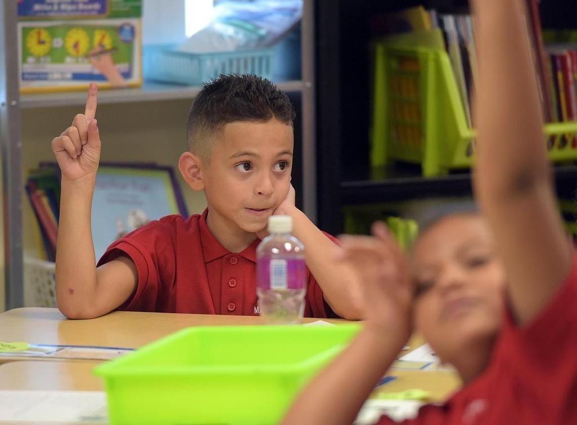 Alexander Aragon, 8, a third-grader at Manatee Charter School, raises a finger Thursday to signify the answer to a question. Manatee Charter School is fighting for its survival this year, as new leaders attempt to change the culture of a school that the School District of Manatee County has threatened to shut down.