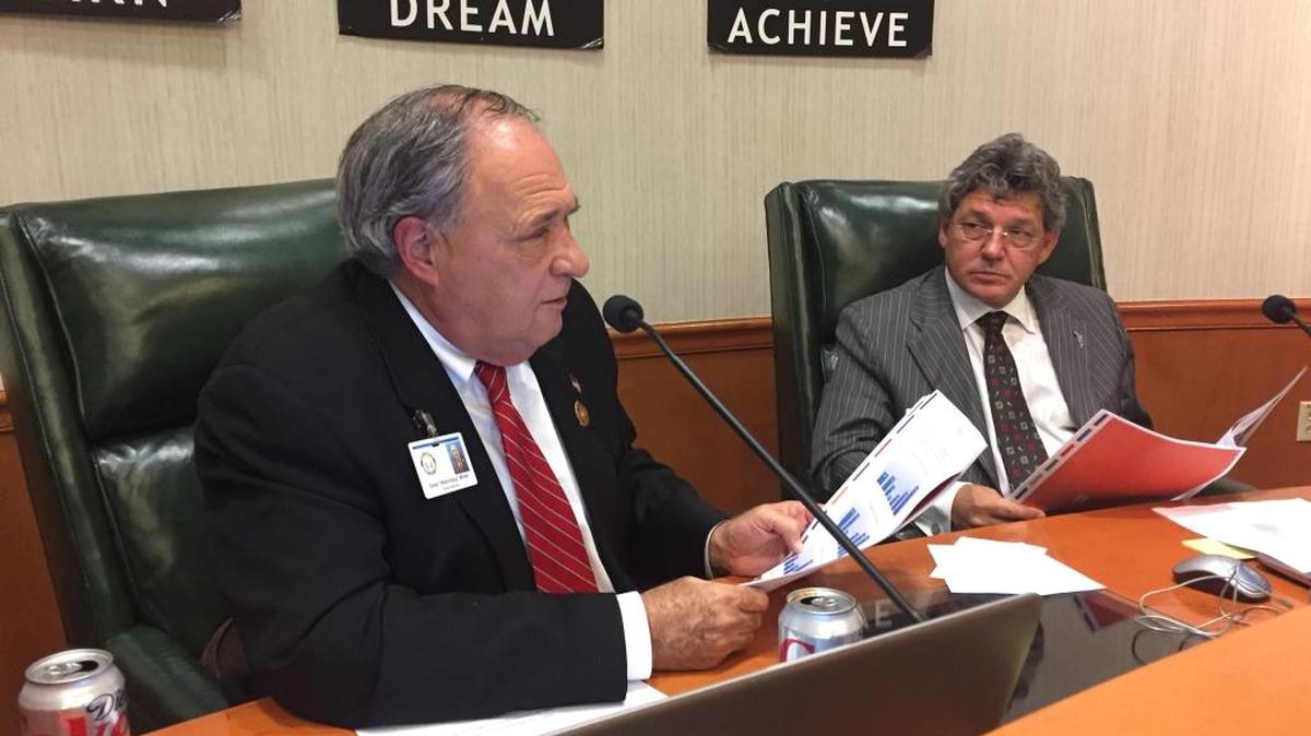 Dave Miner, left, and Scott Hopes at Tuesday night’s School Board of Manatee County meeting. Hopes opposed holding an election to ask voters for a property tax increase, a position that angered Miner, who has argued strongly for it.