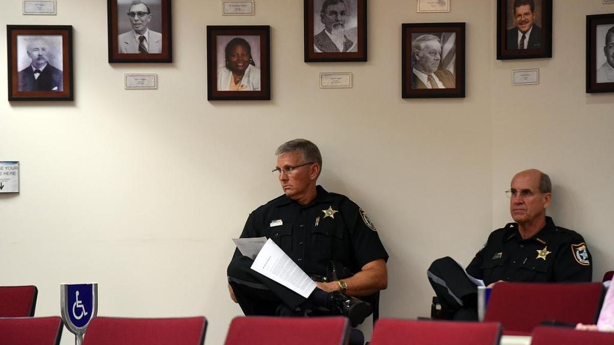 Chief Deputy Rick Wells and Sheriff Brad Steube listen as Manatee County Administrator Ed Hunker presents his proposed budget Thursday afternoon.