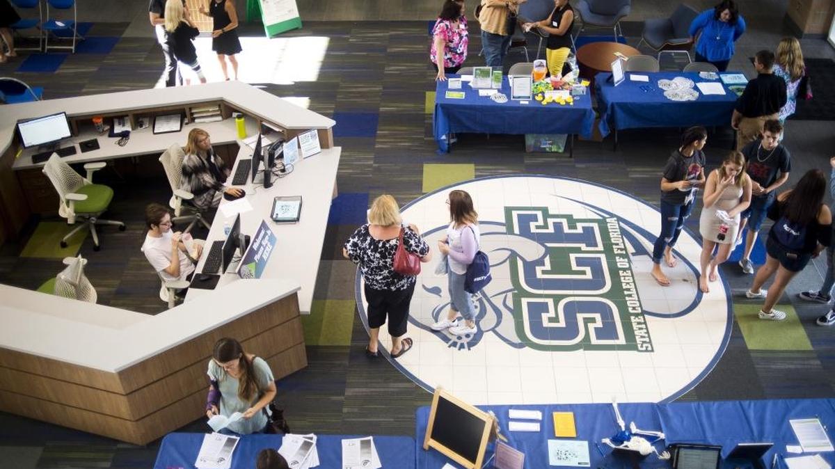 Students gather in the Student Services Center as State College of Florida hosts its “Back to School Bash” Tuesday afternoon as students prepare for the start of the new school year.