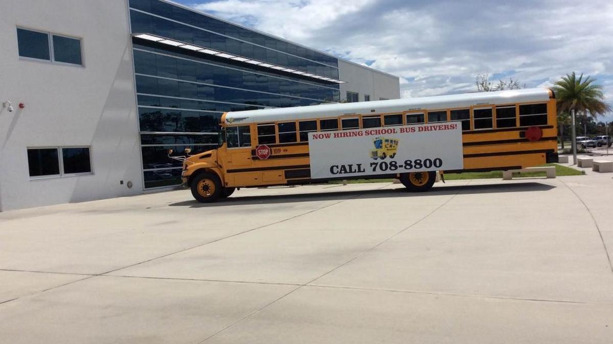A school bus parked outside of Manatee Technical College on Thursday advertised open bus driver positions.