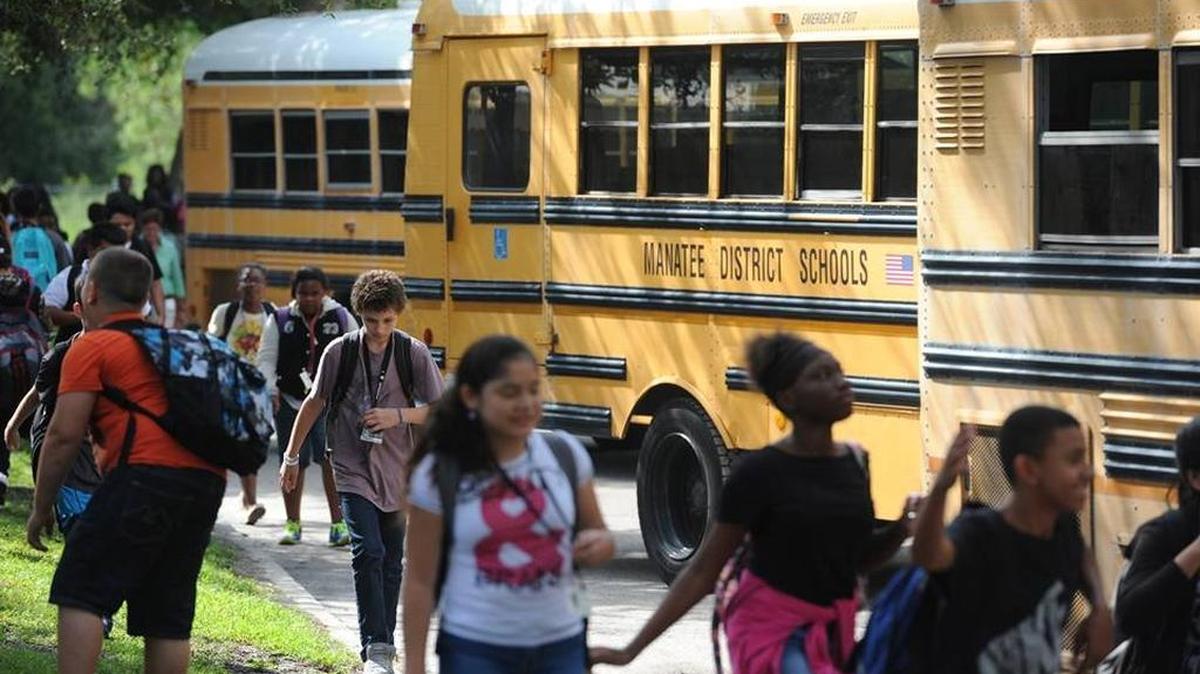 In this file photo, students board Manatee County School District buses at King Middle School.