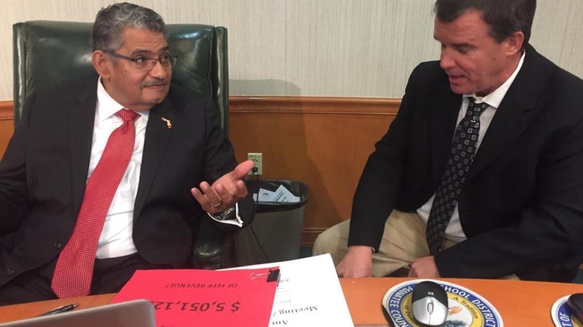 School Board of Manatee County vice chairman John Colon (left) and board chairman Charlie Kennedy at Tuesday night’s School Board of Manatee County meeting. Kennedy is a strong advocate for raising property taxes, but Colon opposes an increase.