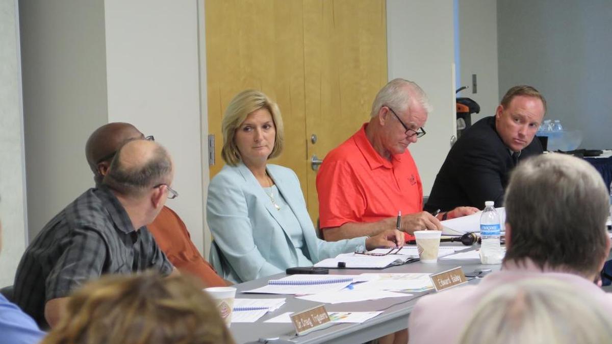 State College of Florida President Carol Probstfeld listens to trustee Dr. Craig A. Trigueiro speak Tuesday during a meeting held in Lakewood Ranch.