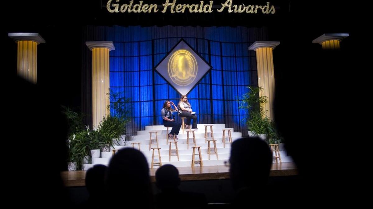 Abigail Harris and Miriam Schmoll, of Bayshore High School, sit on stage after accepting their awards on Thursday evening at the Golden Herald Awards Ceremony at the Neel Performing Arts Center in Bradenton.