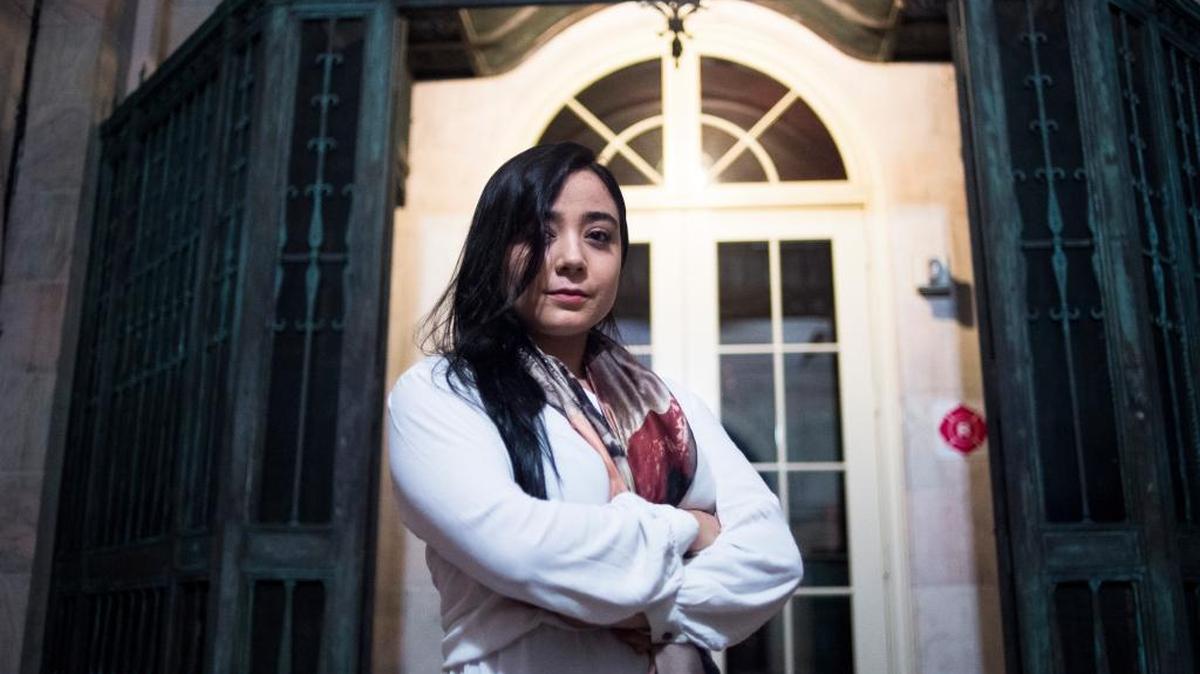 Ximena Pedroza, 19, poses for a portrait at College Hall at the New College of Florida campus on Thursday evening. Pedroza, a student at New College, is petitioning the administration to classify the college as a sanctuary campus.