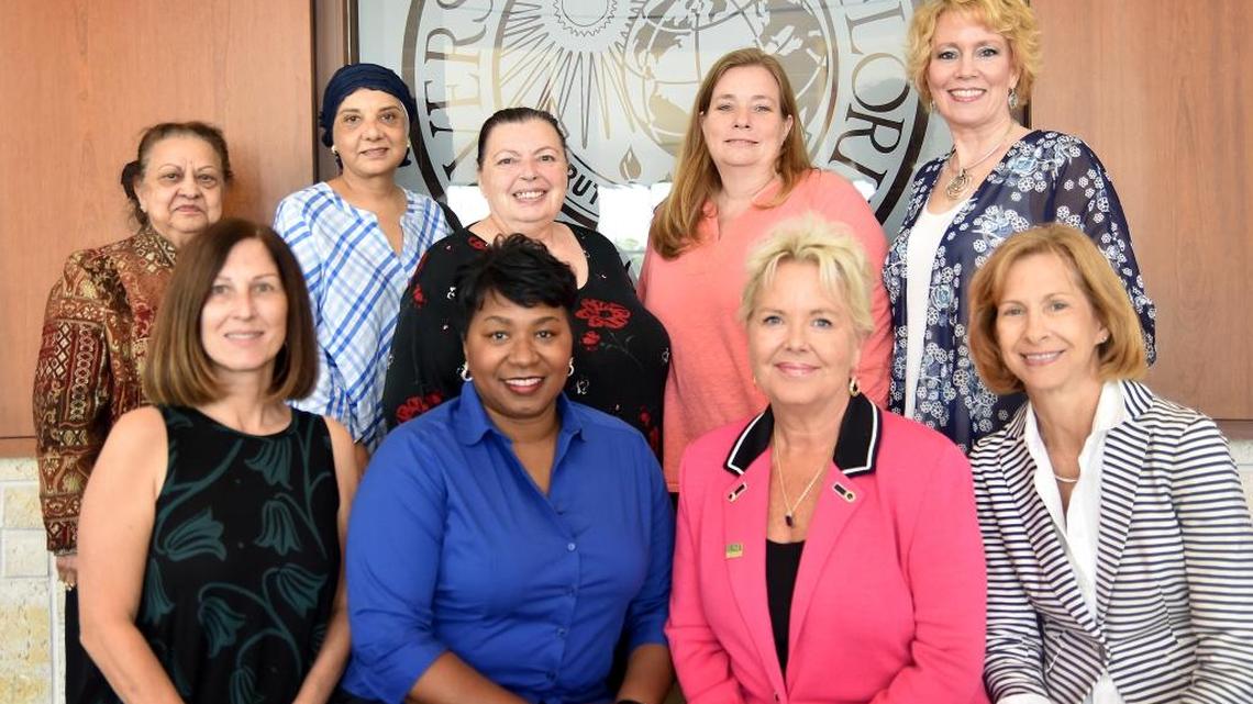 Members of the Florida Commission on the Status of Women Foundation and Manatee County Superintendent Diana Greene, seated second from left, pose for a photo after a foundation board meeting Saturday at USF Sarasota-Manatee