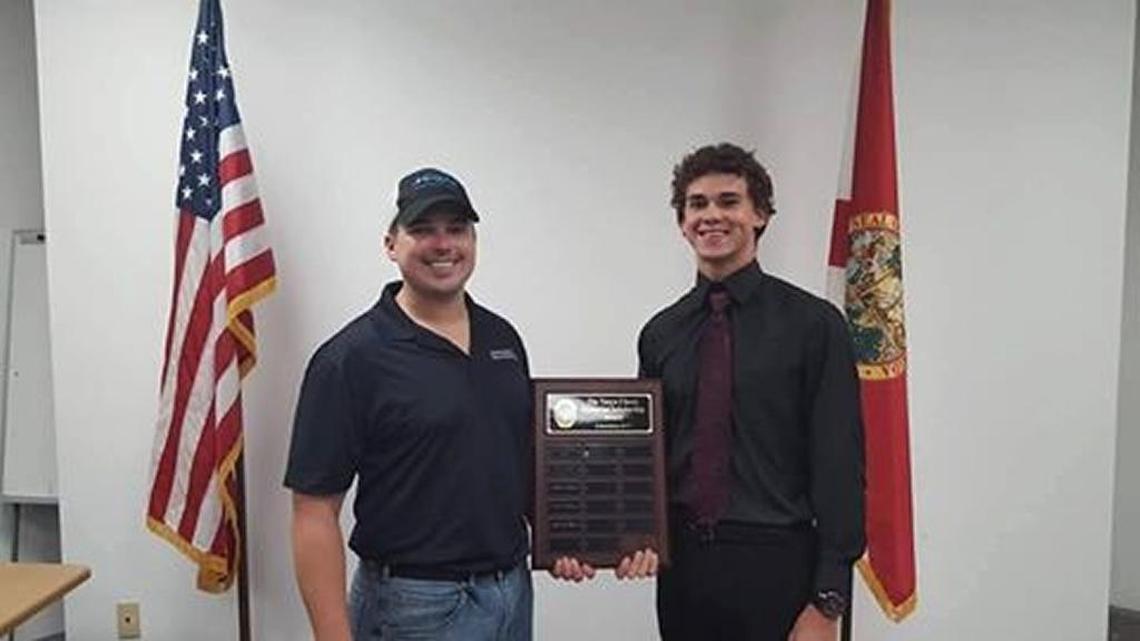 Adam Spatafora and Yandy Rocamora pose for a photo after the Tanya Clavey Memorial Foundation awarded Rocamora a full scholarship to the Law Enforcement Academy at MTC.