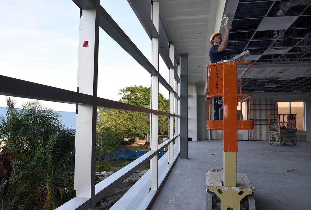 A worker in the new library at Bradenton's State College of Florida Campus.