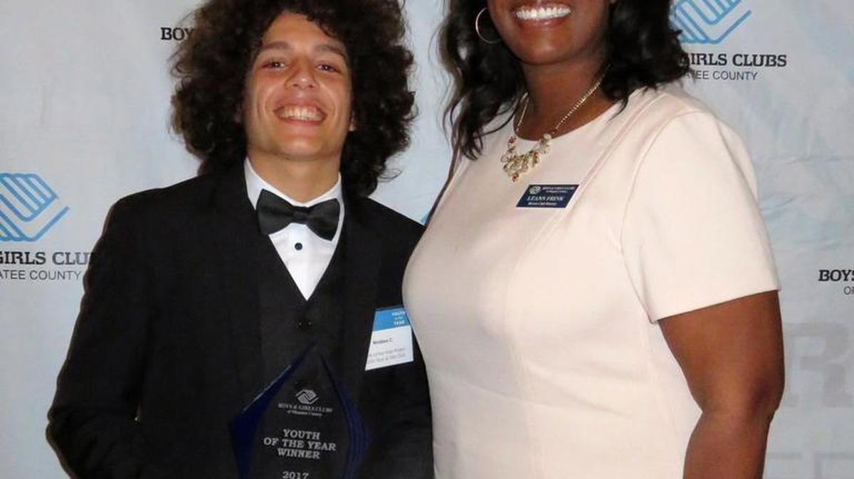 Bayshore High School senior Nicklaus Charles-Crowl, seen here with DeSoto Club Director Leann Frink, was named the Youth of the Year by the Boys & Girls Clubs of Manatee County. On Friday he will travel to Orlando for the state competition.