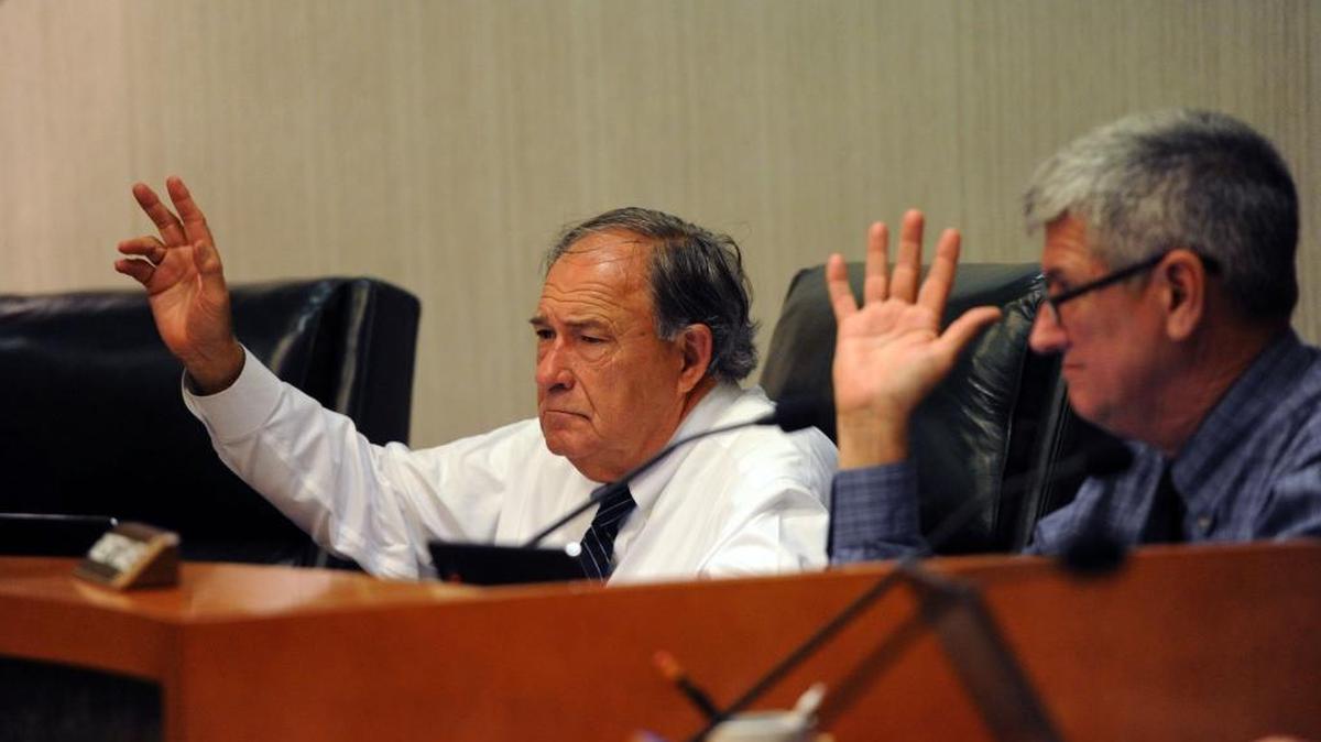 Manatee County School Board members Dave Miner and Robert Gause raise their hands to ask questions as the board works through the 2016-17 budget during a workshop Monday at the School Support Center in Bradenton.