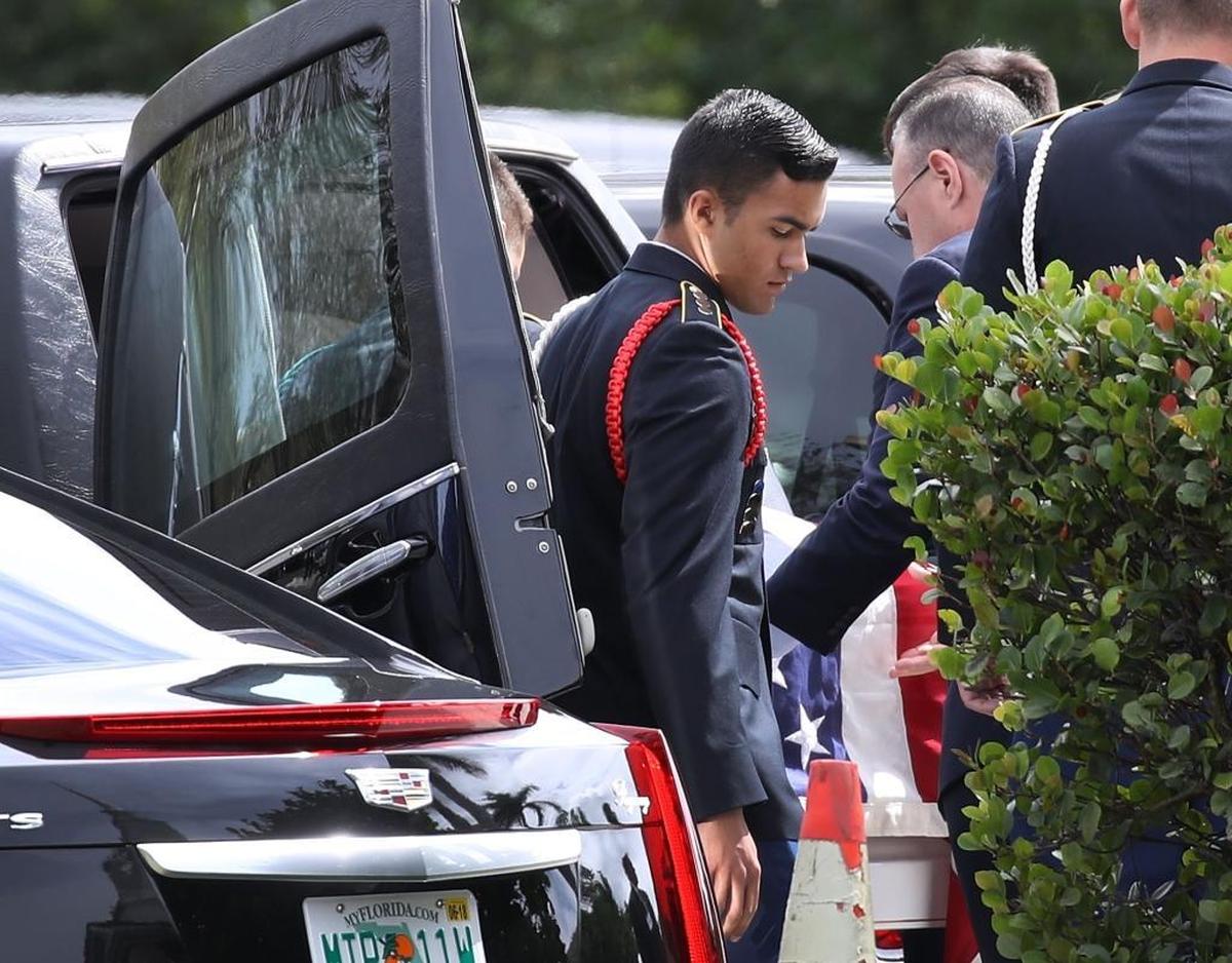 The flag-draped coffin of Alaina Petty is placed in a hearse after her funeral at The Church of Jesus Christ of Latter-day Saints on Feb. 19, 2018, in Coral Springs. Petty, a 14-year-old student at Marjory Stoneman Douglas High School, was one of 17 people killed in the Feb. 14 school shooting in Parkland.