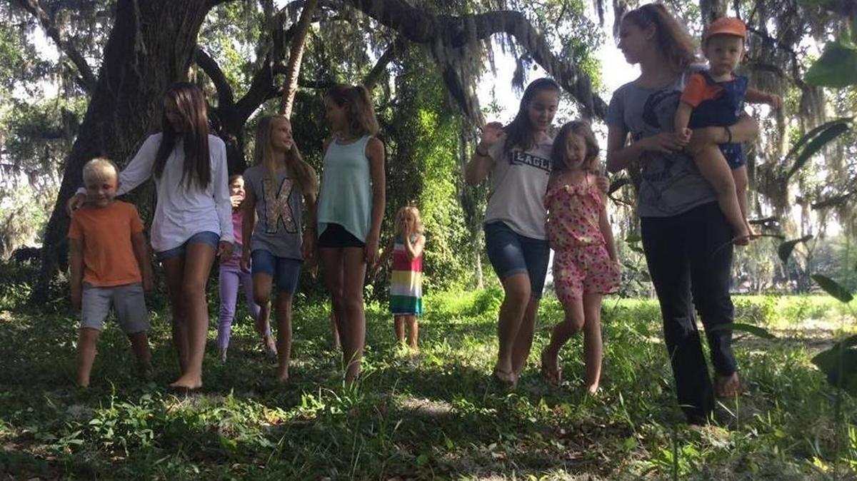 Children that live near the former Palm View Golf Course play in their favorite spot bordering the old course and their homes. Residents are concerned about potential environmental hazards that could be released from the course if a proposed development goes forward. File photo