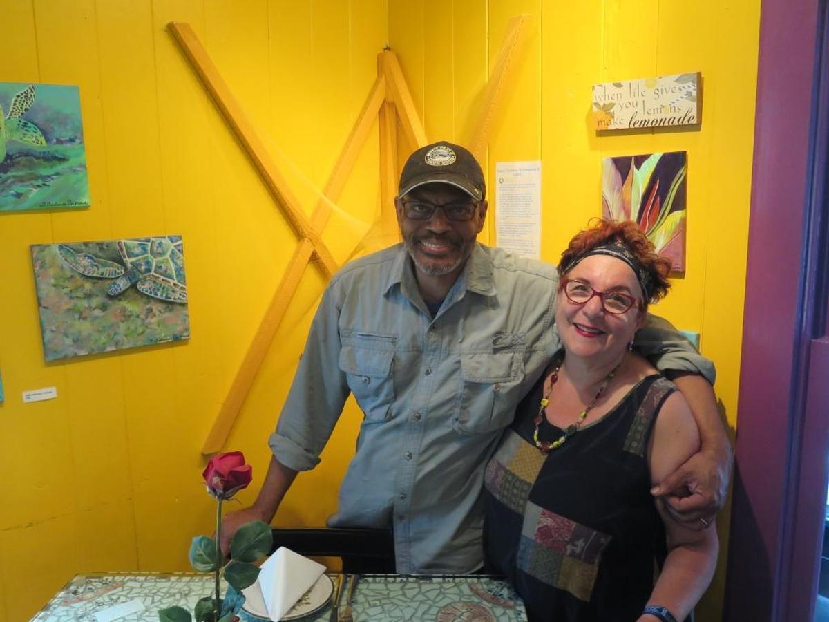 Chef Jim Copening and Donna Slawsky pause for a moment in their Arts & Eats restaurant. The couple announced they will permanently close their doors after Mother’s Day in order to spend more time traveling and enjoying their lives with one another.