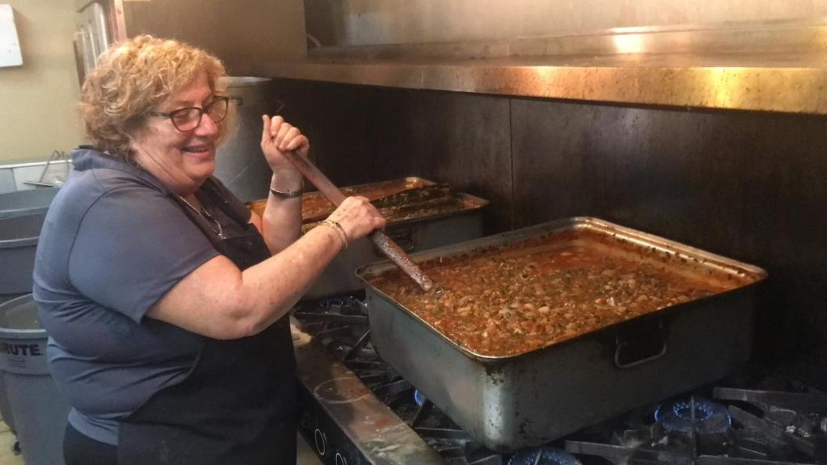 Popi Ameres makes a gigantic pan of sauce for the fish plaki at the 2018 Saint Barbara Greek Festival.