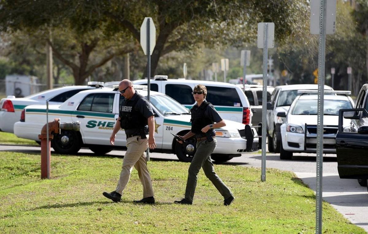 Manatee County Deputies arrive after a threat written on the wall of a girls restroom at Southeast High led to a lockdown for hours, keeping students in their classrooms and worried parents outside the school.