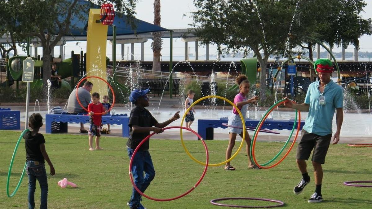 Kids follow an instructor’s lead while playing with Hula-Hoops and enjoying the weather at the Riverwalk in Bradenton on Saturday. This week’s weather will allow for all sorts of sun-splashed activities.