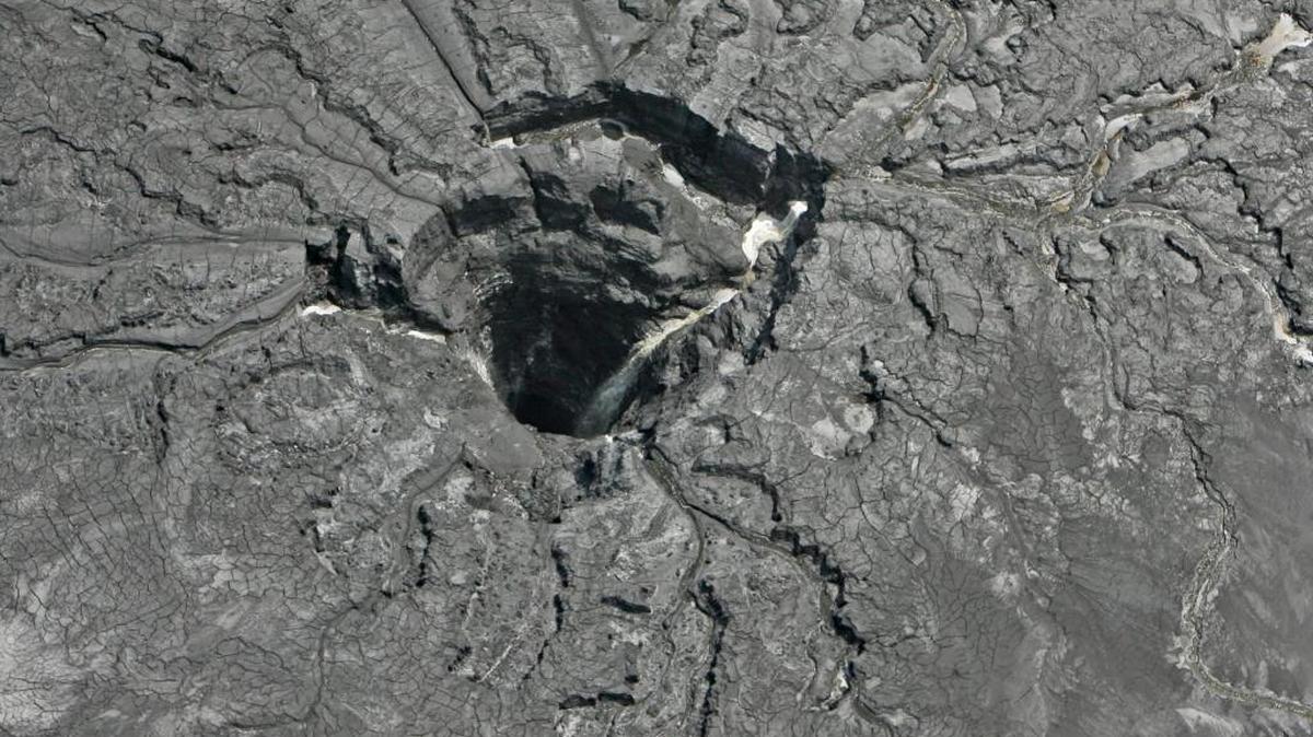 An aerial photo shows a massive sinkhole Sept. 16 in Mulberry that opened up underneath a gypsum stack at a Mosaic phosphate fertilizer plant.