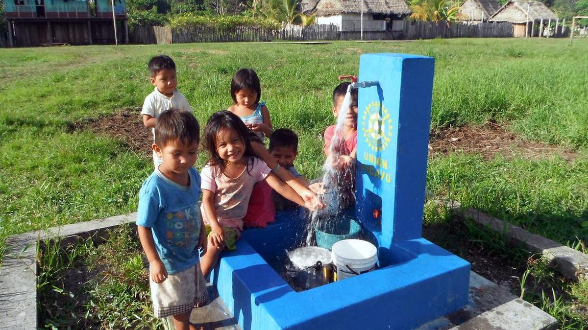 A group of children receive clean water for the first time after the Rotary Club of Lakewood Ranch completed a project in their village in Peru.