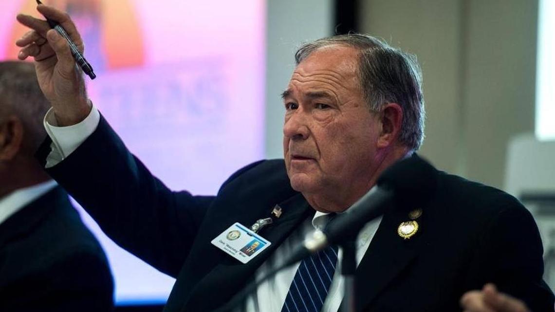 Dave Miner asks a question during a candidates forum Oct. 18 in Bradenton.