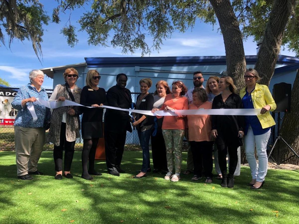 Manatee County commissioners and Manatee County Animal Services staff cut the ribbon over the new EasyTurf installed for dogs at the Palmetto shelter on Wednesday.