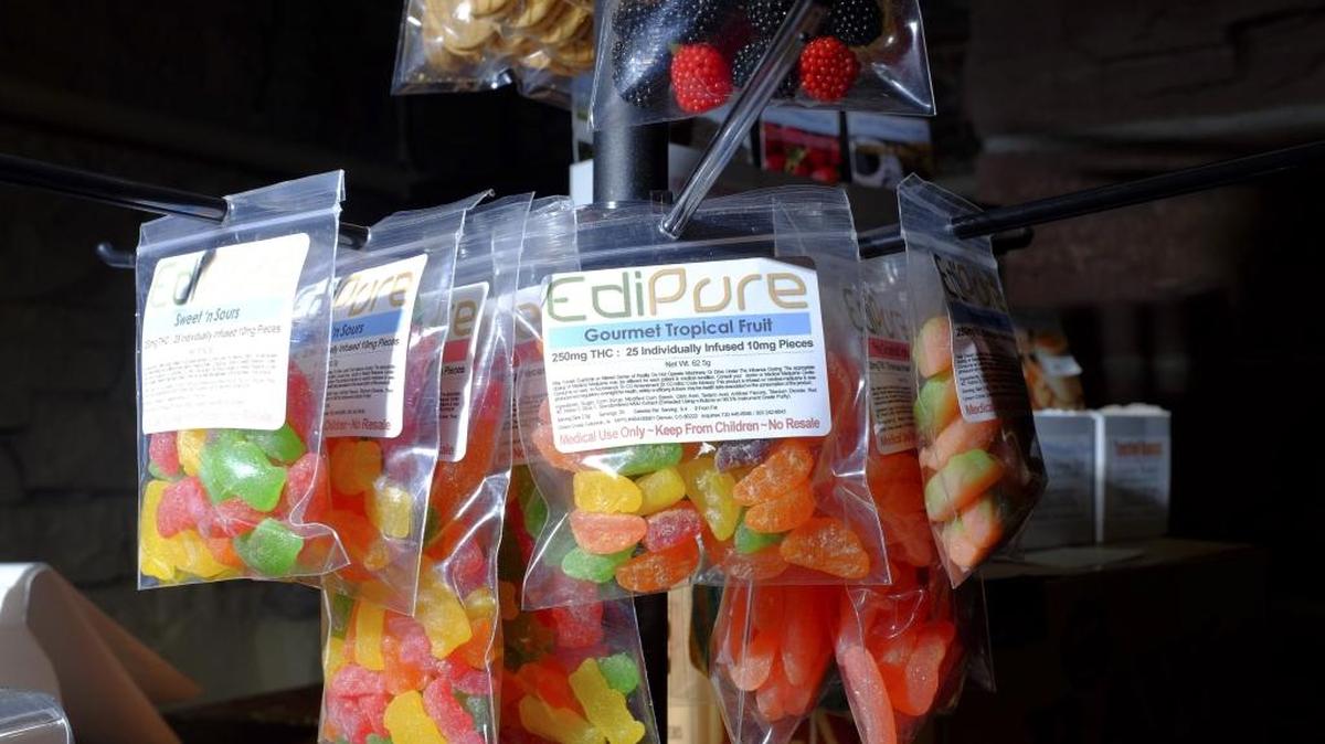 Packages of marijuana-infused candies for sale at the LoDo Wellness Center in Denver. Florida law allows for edible marijuana products, but requires that the Department of Health set rules regulating ingredients and other details before edibles can be produced and sold.