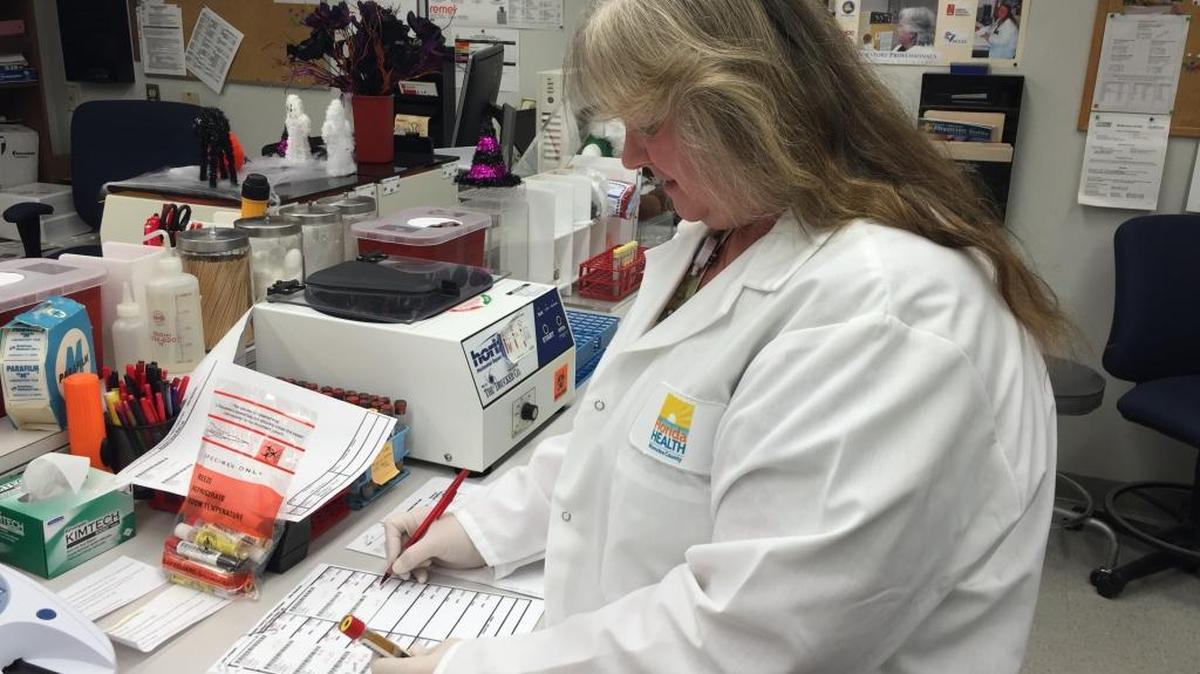 Lori Maness, a Florida Department of Health lab technician, gets set to do a lab test at the office, located at 410 Sixth Ave. E., Bradenton. The local health department can test for sexually transmitted diseases.