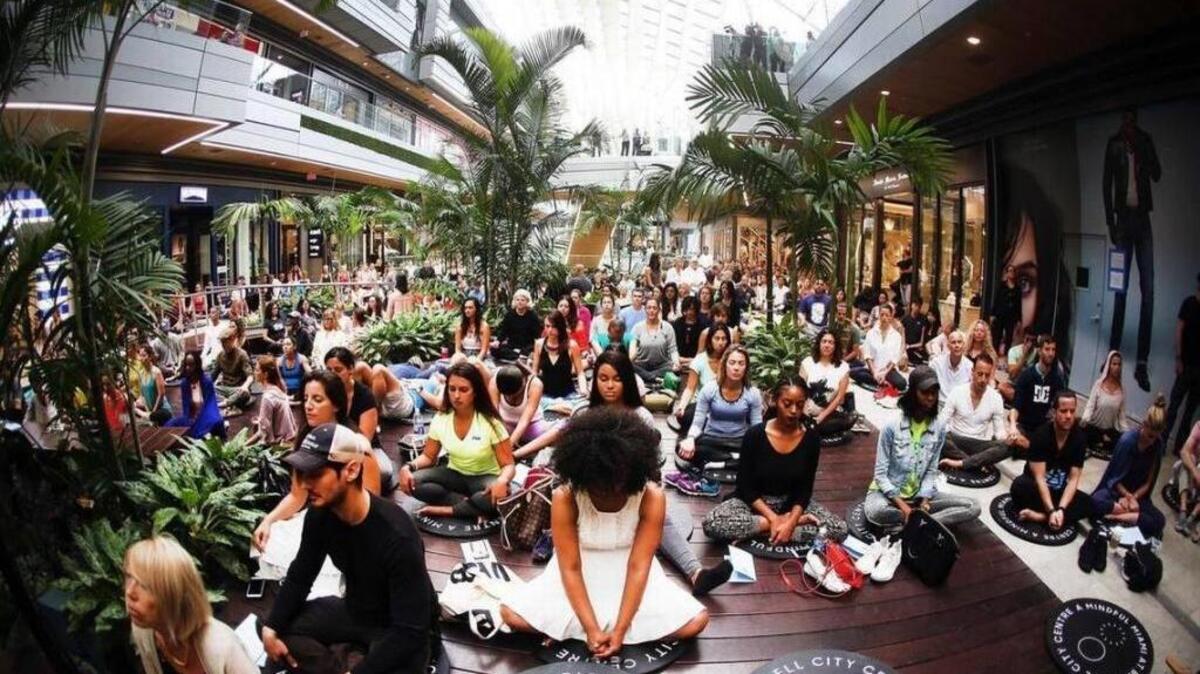 Hundreds gathered earlier this year for a group meditation at Brickell City Centre to celebrate Earth Day. Interest in meditation has increased in light of scientific research that supports claims of its healthy benefits.