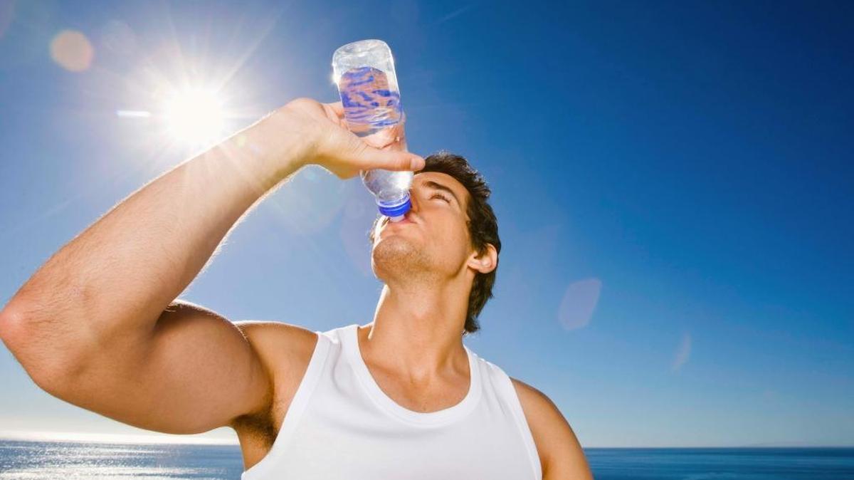 To stay cool while wearing sun-protective clothing, carry two bottles of water on long training runs and rides — one to spray yourself with and another to hydrate