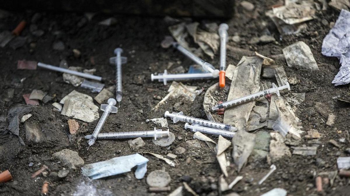 FILE â€“ In this Feb. 2, 2017, file photo, used needles litter the ground at an open air drug market along Conrail train tracks in the Kensington section of Philadelphia. Drug overdose deaths in the U.S. skyrocketed 21 percent in 2016, dragging down life expectancy predictions for a second straight year, according to a report released by the Centers for Disease Control and Prevention on Thursday, Dec. 21, 2017.