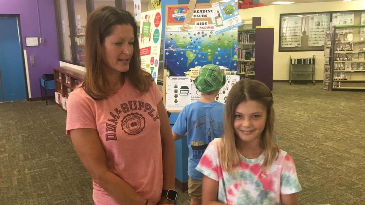 Bradenton’s Tracy Beckner, left, and her daughter, Emma, 11, visited the Central Branch of the Manatee County Public Library a few days ago to get some summer reading for Emma. Emma does love her “screen time” but her mom wants her to read books this summer. “It helps in their imaginations and they need that these days in the classroom,” Tracy Beckner said of reading books.