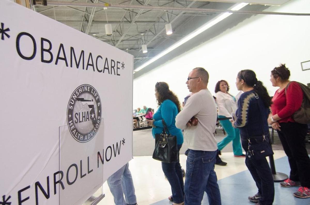 In this archive photo, consumers wait for help enrolling in private health insurance through the Affordable Care Act in Miami. Open enrollment for ACA coverage began on Nov. 1. The deadline to enroll is Jan. 15, 2022.