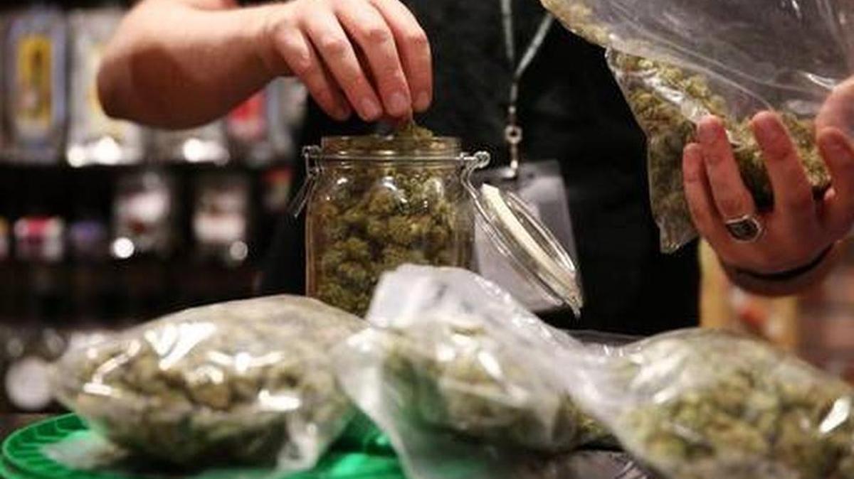 Assistant manager Dunn Ericson refilled a jar of medical marijuana at the River Rock Medical Marijuana Center in Denver, Colorado, on May 16, 2013.