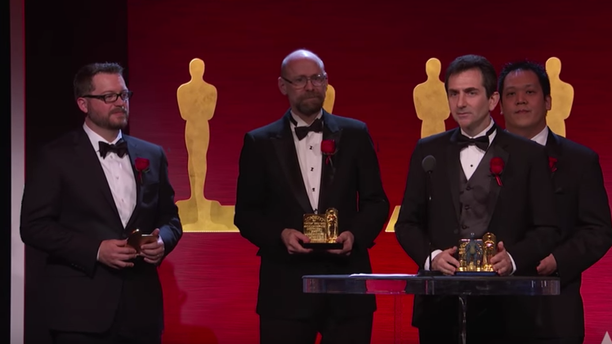 New College of Florida graduate Steven Rosenbluth, at podium, accepts an Academy Award for his groundbreaking visual effects work.